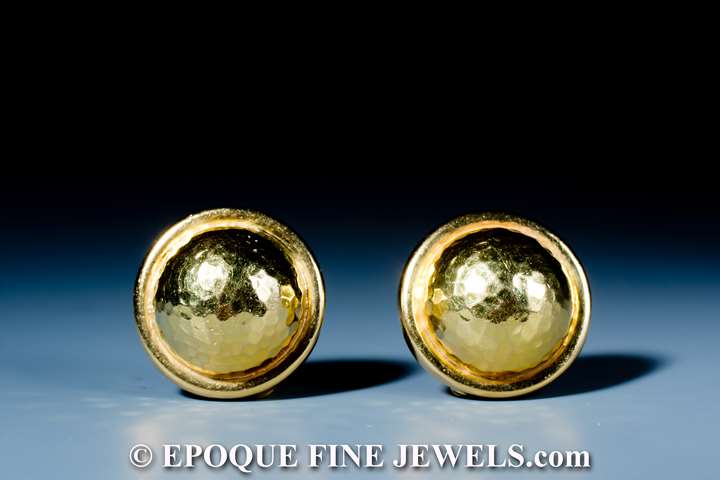 A funky pair of 18 karat gold earrings,